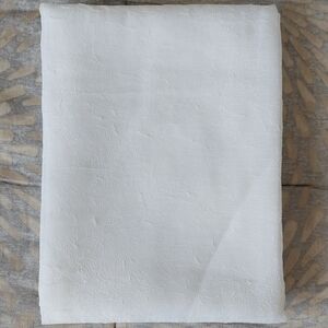 Room Essentials white sheer curtain panel.